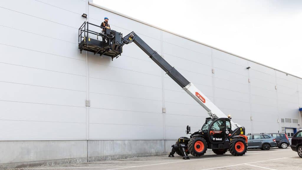 yellow and black heavy equipment on snow covered ground during daytime